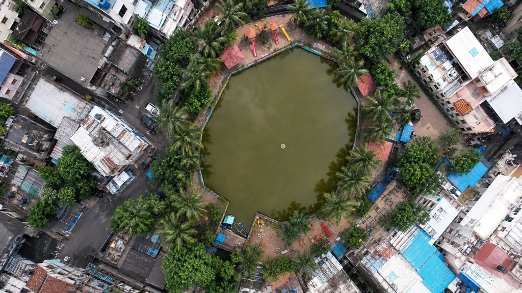 Aerial view of Rao Talao, Mira Bhayandar, before the project, with green, algae-coloured water
